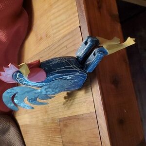 Wooden shelf sitting rooster